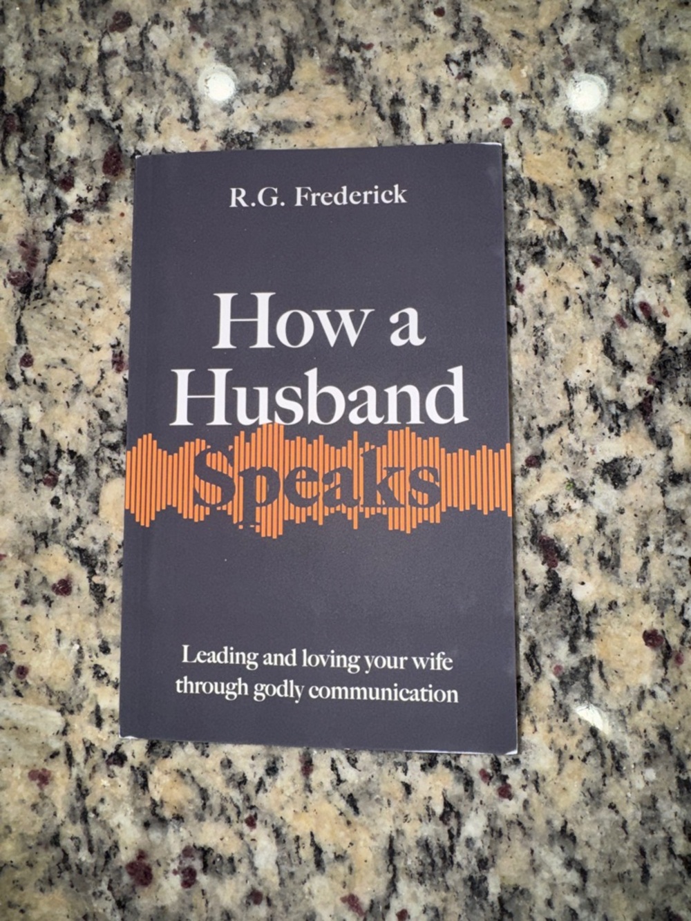 How a Husband Speaks by R.G. Frederick - Navy & Orange Paperback